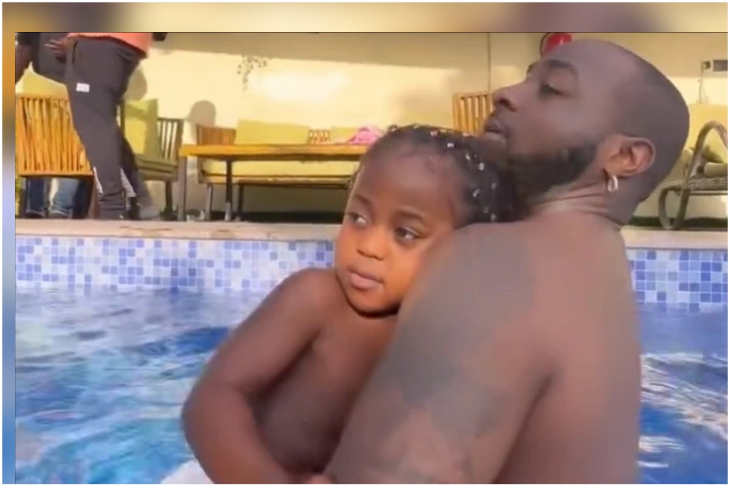 Singer, Davido And Son, Ifeanyi Adeleke Swim Together In A Swimming Pool